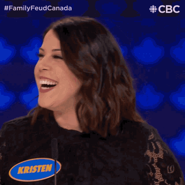 a woman with a name tag that says kristin is laughing