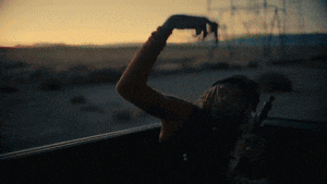 a woman is taking a picture of herself in the back of a car