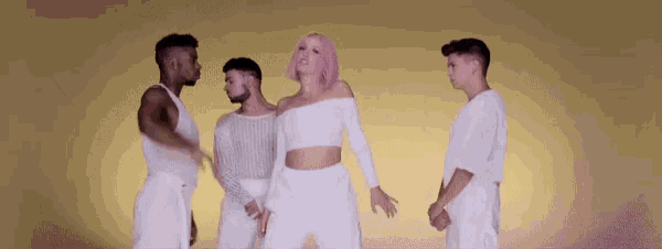 a woman with pink hair is surrounded by three men in white shirts