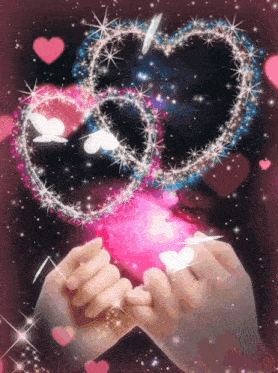 a couple 's hands are holding each other in front of two hearts