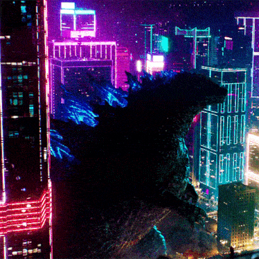 a monster stands in front of a city at night