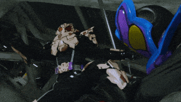 a blurred image of a person standing in a room with balloons flying around them