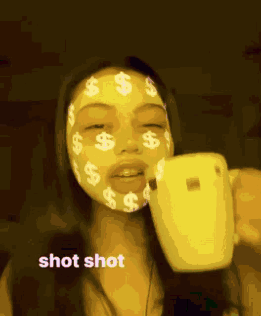 a woman with dollar signs painted on her face is taking a shot of herself .