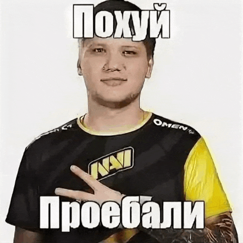 a man wearing a black and yellow shirt with a navi logo on it is making a funny face .