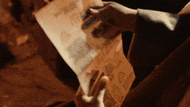 a person holding a piece of paper that says p3ns1v3.tumblr.com on it