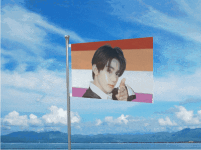 a flag with a picture of a man on it is flying in the wind