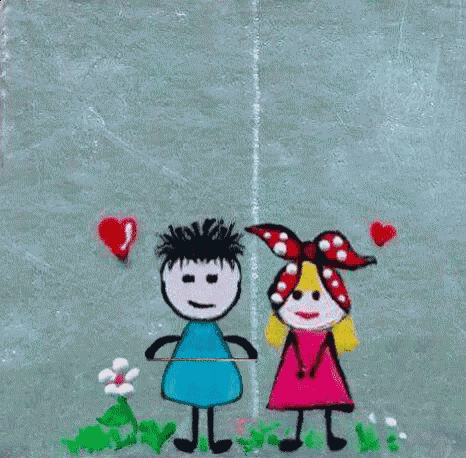 a boy and a girl are holding a sign that says feliz ano novo