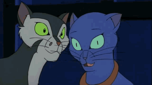 a blue cat and a gray cat with green eyes are standing next to each other