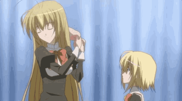 a girl with long blonde hair is standing next to a girl with short blonde hair