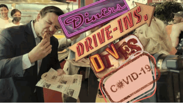 a man eating at a diner with a sign that says drive-ins on it