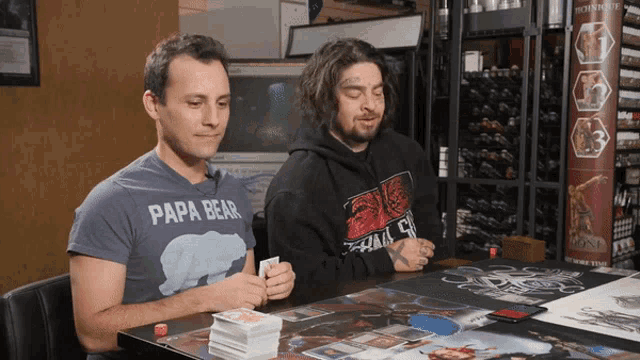 a man wearing a papa bear shirt is playing a game