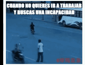 a man on a motorcycle is standing in the middle of a street next to another man on a scooter ..