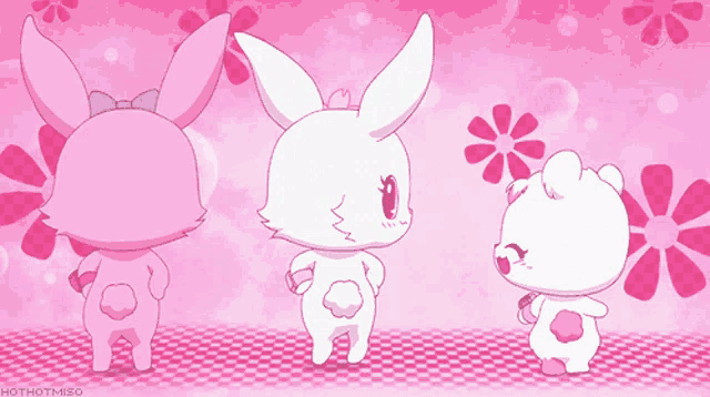 three pink rabbits are dancing in front of pink flowers and the words hothotmiso are below them