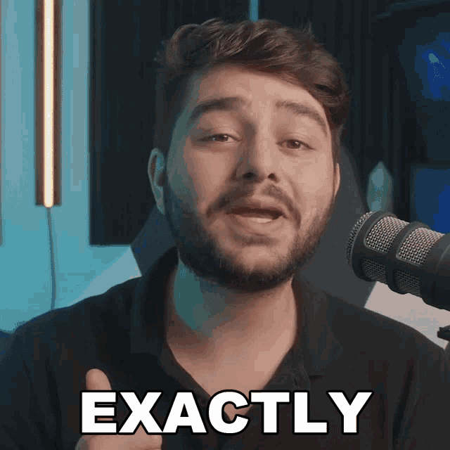 a man with a beard is giving a thumbs up next to the words exactly