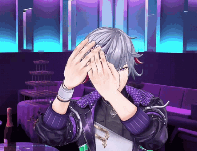 a man in a purple jacket is covering his eyes with his hands