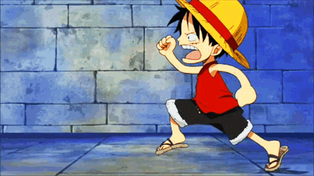 a cartoon character with a straw hat is running in front of a brick wall
