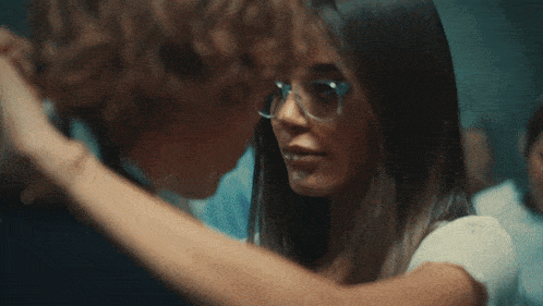 a man and a woman are hugging each other