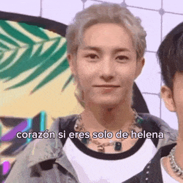 a close up of a person 's face with the words `` corazon si eres solo de helena '' written on the bottom .