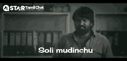 a man with a beard is standing in front of a wall with binders and a sign that says soli mudinchi .