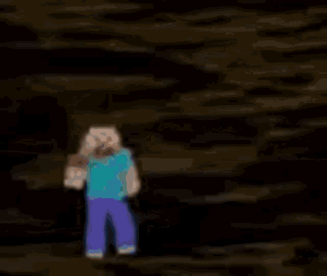 a blurred image of a person standing in the dark .