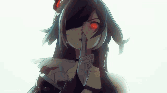 a close up of a girl with red eyes holding a knife in her hand .