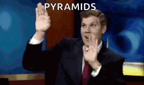 a man in a suit and tie is giving a high five with the words pyramids above him