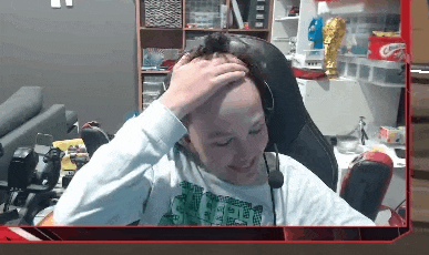 a person is sitting in a chair with headphones on their head .