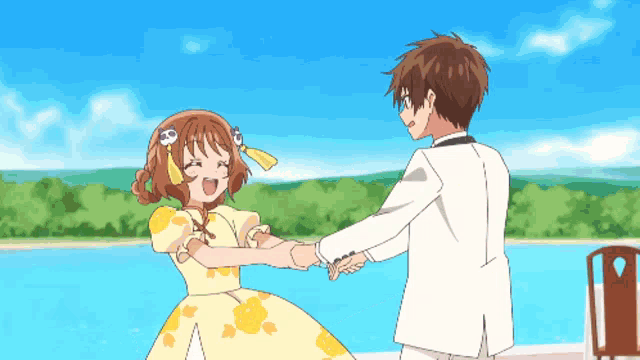 a boy and a girl are holding hands in front of a pool