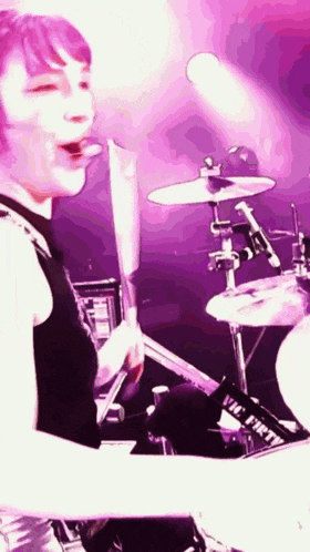 a person is playing drums with a vic firth drum strap