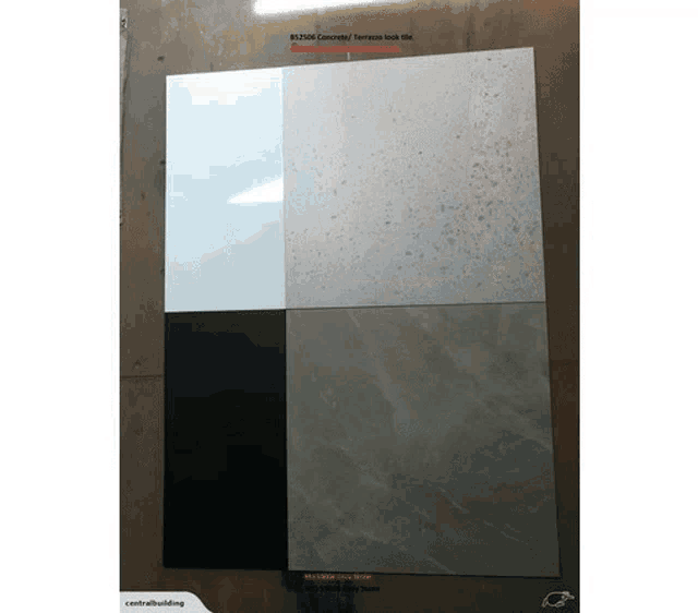 four different tiles are displayed on a wall including white black and tan