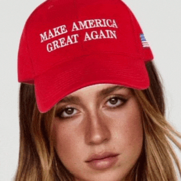 a woman wearing a red hat that says " make america great again "