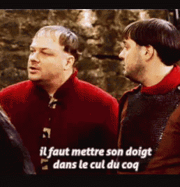 two men are standing next to each other and one of them is talking in a foreign language .