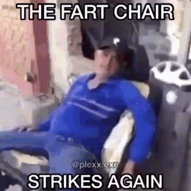 a man in a blue shirt is sitting in a chair with a caption that says the fart chair strikes again .