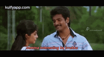 a man and a woman are standing next to each other and the man is saying `` semma interesting ka irukku '' .