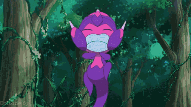 a purple flower is floating in the air in the middle of a forest .