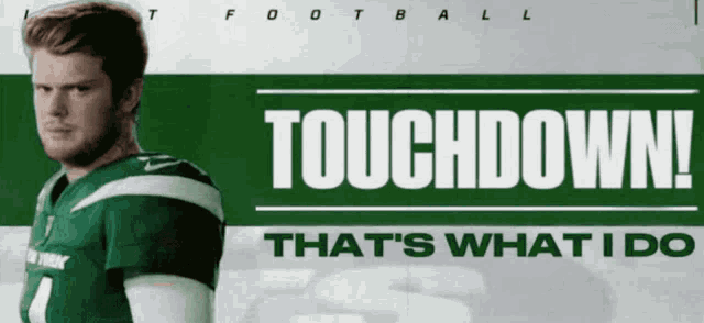 a man in a green jersey stands in front of a banner that says touchdown that 's what i do