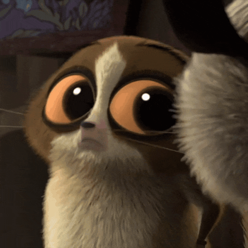 a close up of a cartoon cat 's face with big eyes