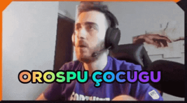 a man wearing headphones and a purple shirt says orospu cocugu