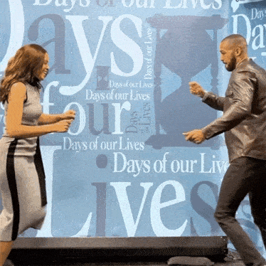 a man and woman are dancing in front of a sign that says days of our lives
