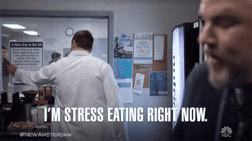 a man says i 'm stress eating right now while another man looks on