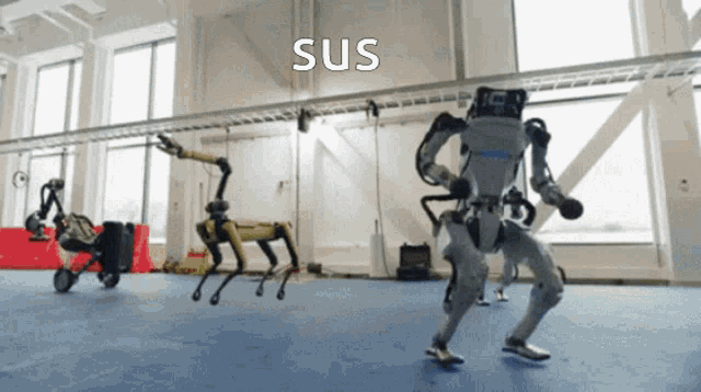 a bunch of robots are dancing in a room and the word sus is on the bottom