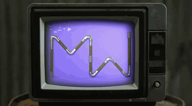 a tv with a purple screen and the letter m on it