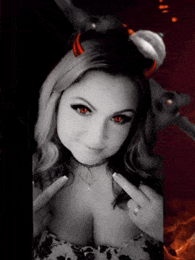 a woman with red eyes and horns is wearing a necklace with a cross on it