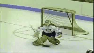 a hockey goalie wearing a jersey that says montreal on it