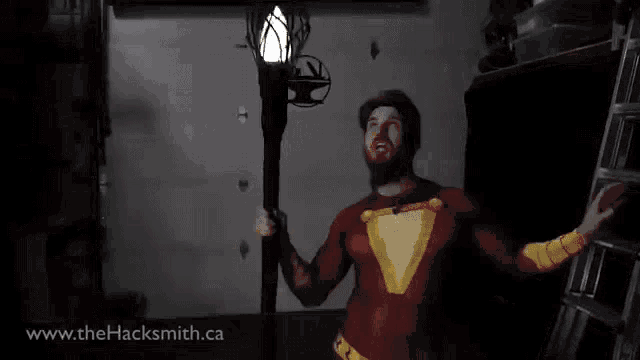 a man in a superhero costume with the website www.thehacksmith.ca in the lower right corner