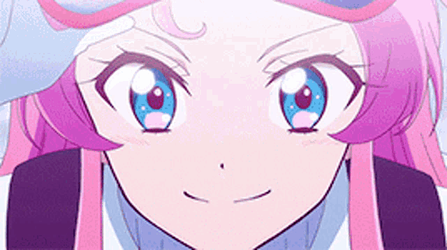 a close up of a cartoon character with pink hair and blue eyes .