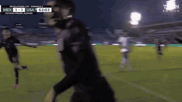 a soccer game between mexico and usa is being shown on television