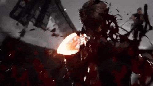 a close up of a person with blood coming out of their mouth and a fireball coming out of their mouth .