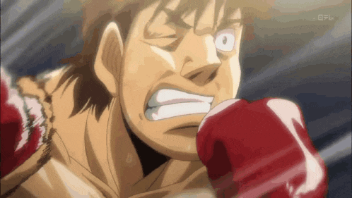 a cartoon of a man wearing red boxing gloves is shown on a television screen