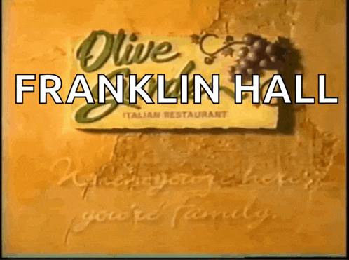 a sign for franklin hall italian restaurant with a bunch of grapes on it